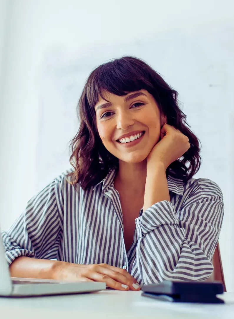 London-Architect-Jane-Sinclair-smiling-at-her-desk